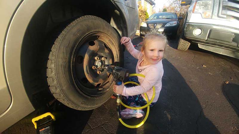 Girl Changing Tire